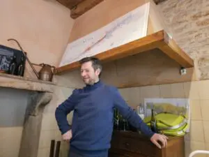 A man stands inside a room at Domaine Bart.