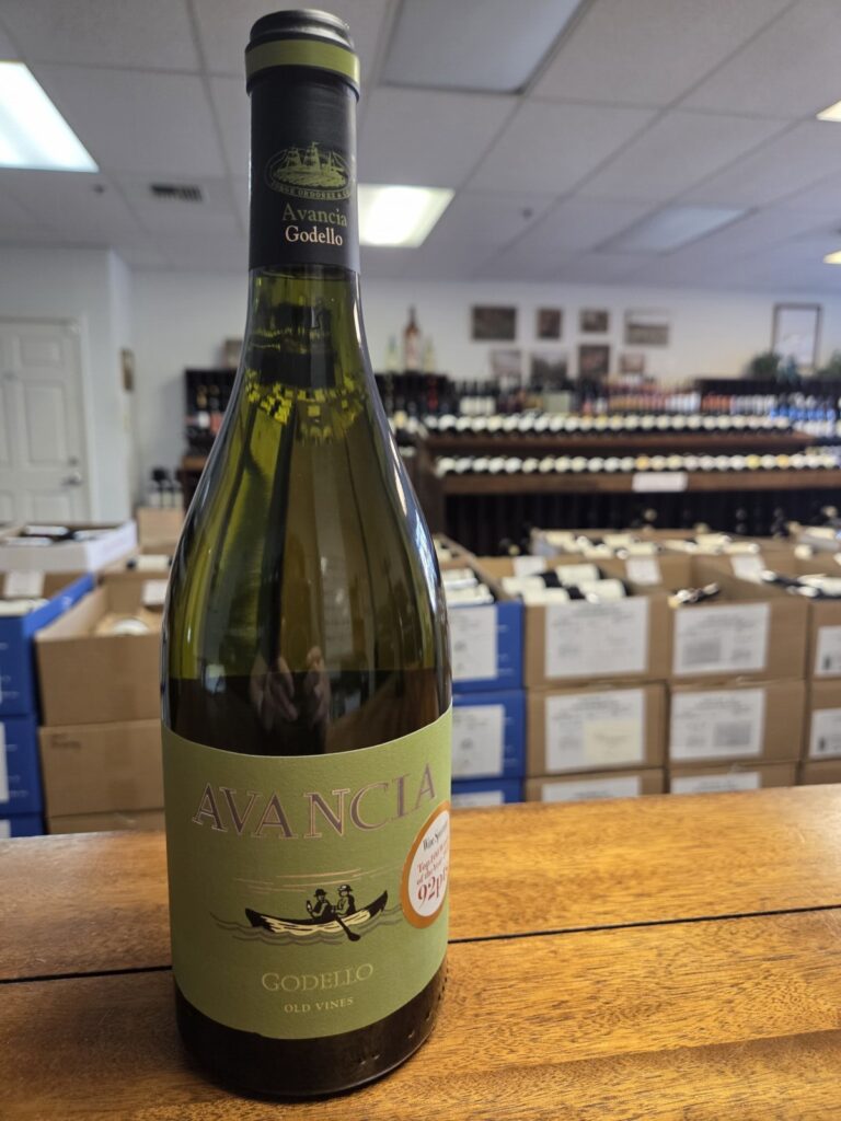 A wine bottle on a counter inside University Wines.