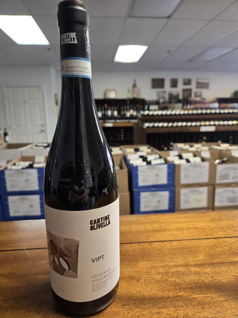 A wine bottle on a counter inside University Wines.