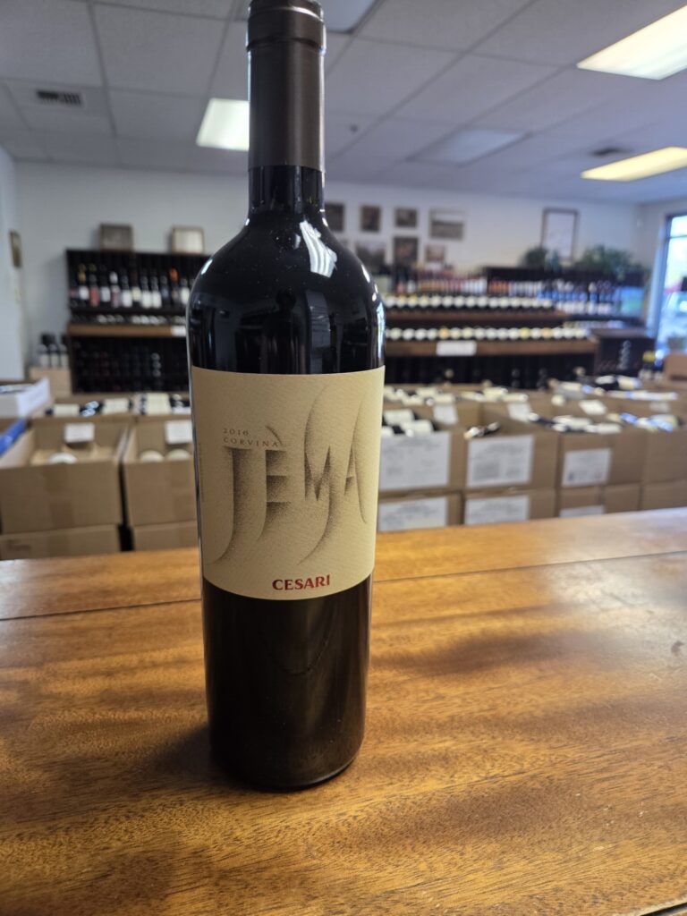 A wine bottle on a counter inside University Wines.