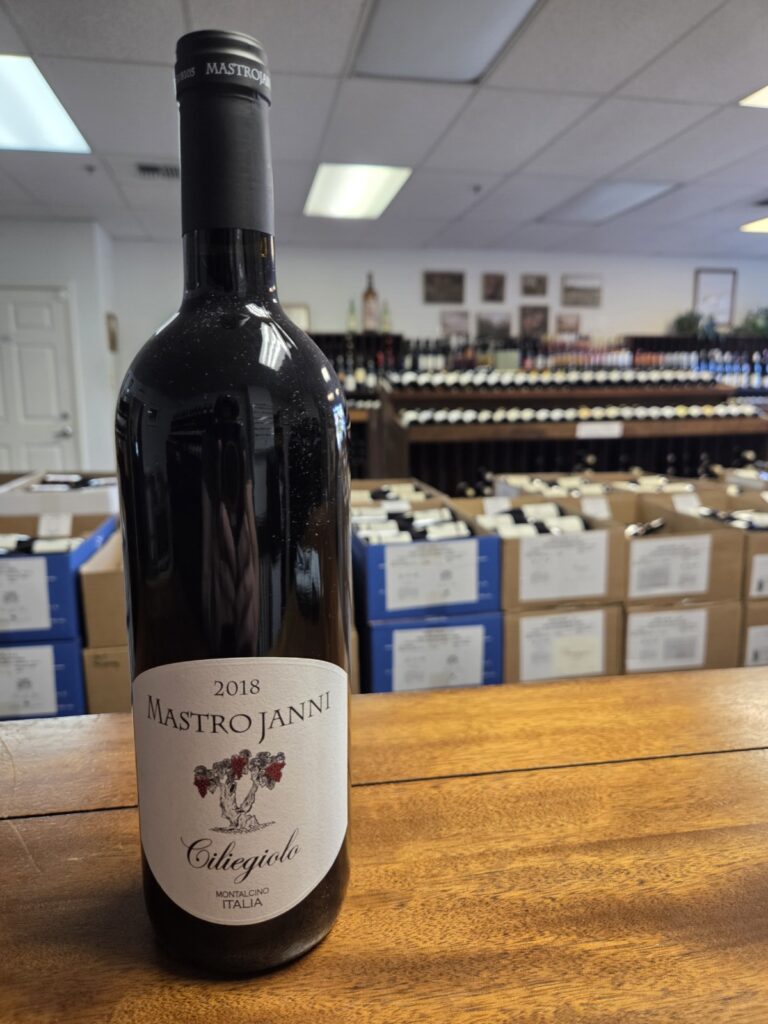 A wine bottle on a counter inside University Wines.