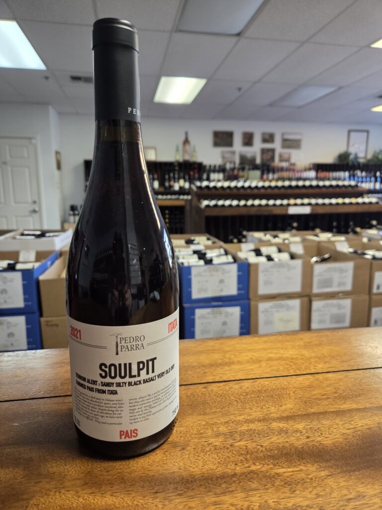 A wine bottle on a counter inside University Wines.