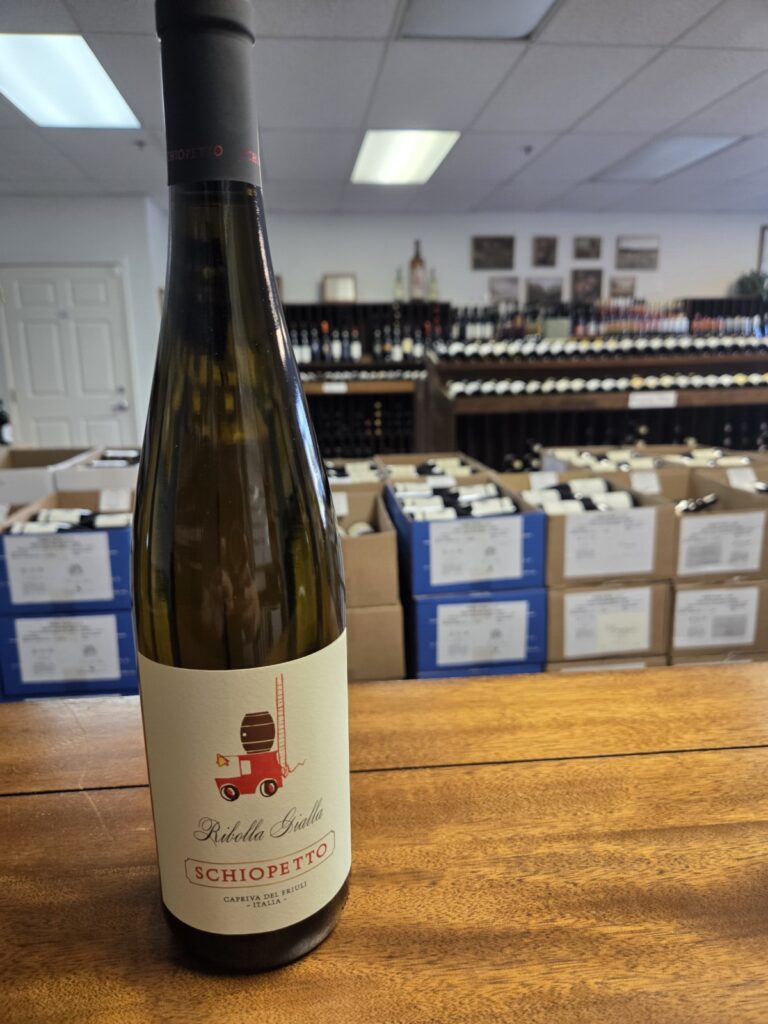 A wine bottle on a counter inside University Wines.