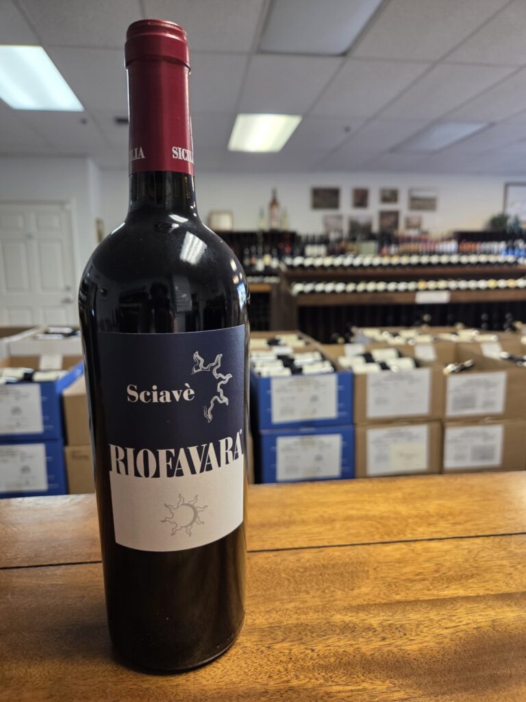 A wine bottle on a counter inside University Wines.