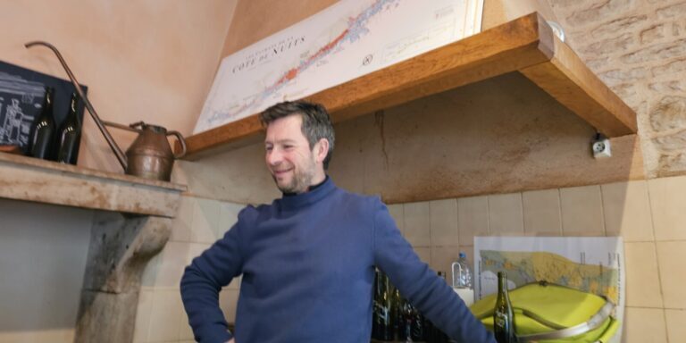 A man stands inside a room at Domaine Bart.