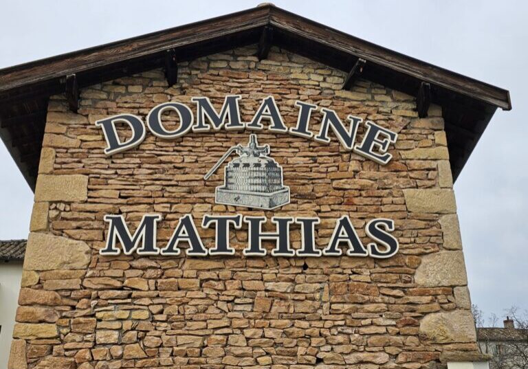 A sign displaying the name Domaine Mathias.